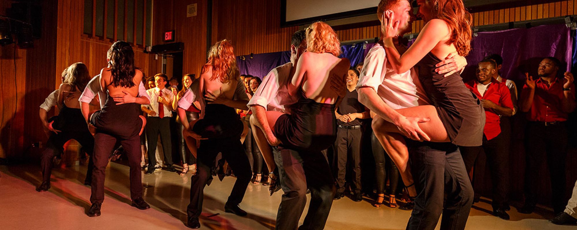 A wide view of a busy salsa club night.